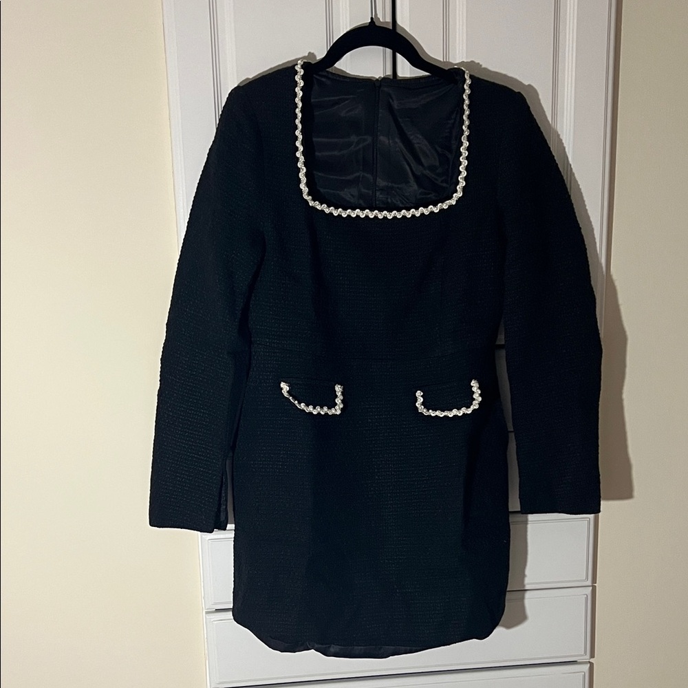 Elegant Black Dress with White Trim